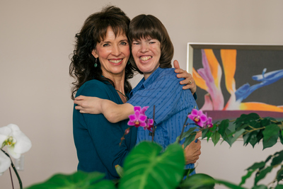 Heather Madsen hugs her mother and caregiver, Debbie Jorde.